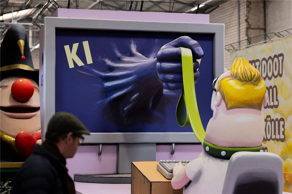 Auch die Gefahren durch KI werden im Kölner Rosenmontagszug thematisiert. Rolf Vennenbernd/dpa