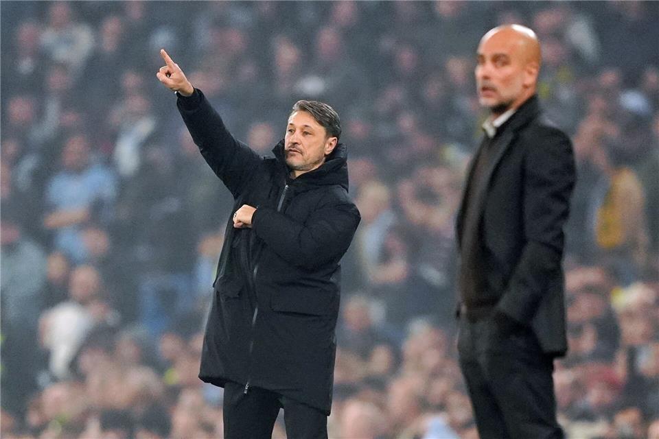 BVB-Coach Niko Kovač (l) verlor mit seiner Mannschaft das Duell gegen das Star-Ensemble von Pep Guardiola.Martin Rickett/PA Wire/dpa