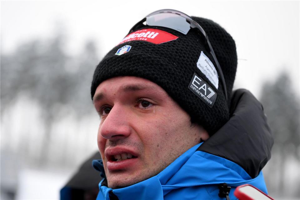 Bei der Erinnerung an seinen Freund weint Tommaso Giacomel. Hendrik Schmidt/dpa