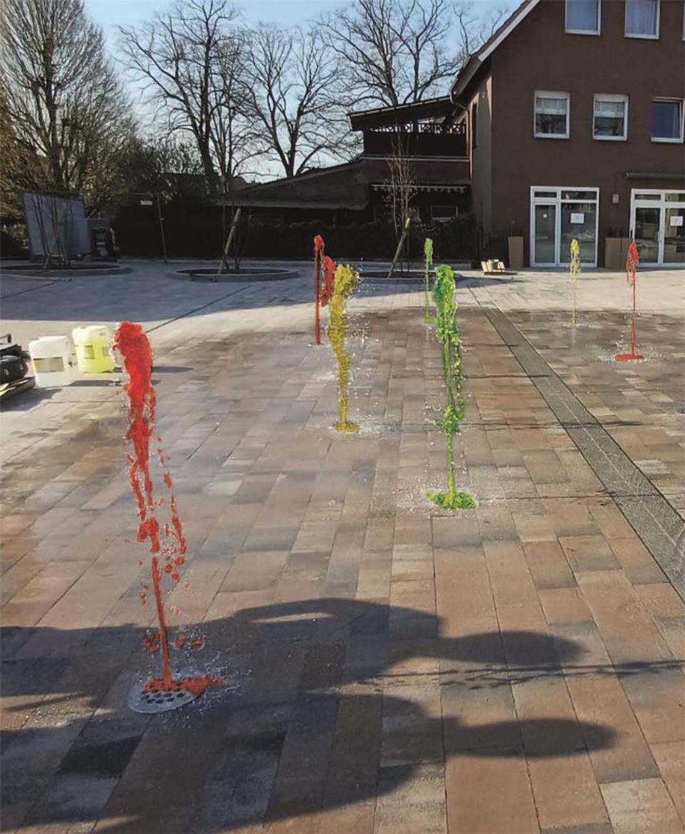Bildmontage: So könnte in Zukunft das Fontänenfeld in Ramsdorf aussehen. Bürger sollen per App die Farben steuern können.