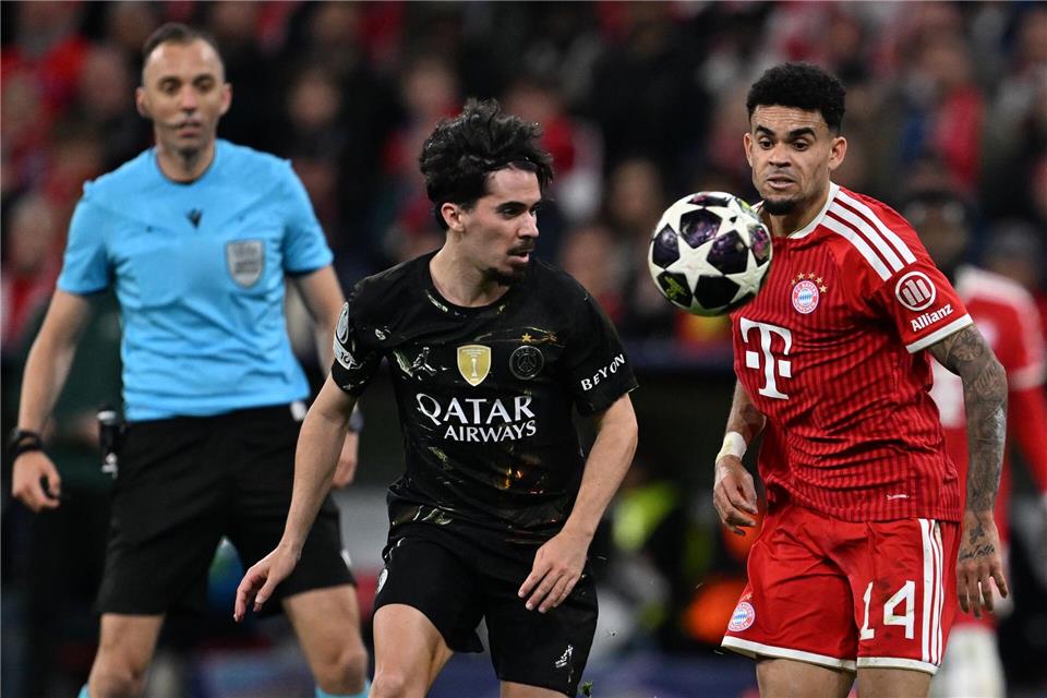 Gegner in der Champions League und bei der WM: Portugals Vitinha von Paris Saint-Germain und Kolumbiens Luis Díaz von Bayern München (r).Sven Hoppe/dpa