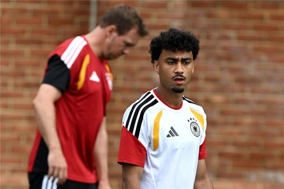 Gute Nachricht für den Bundestrainer (l): Nathaniel Brown ist beim Abschlusstraining dabei.Federico Gambarini/dpa
