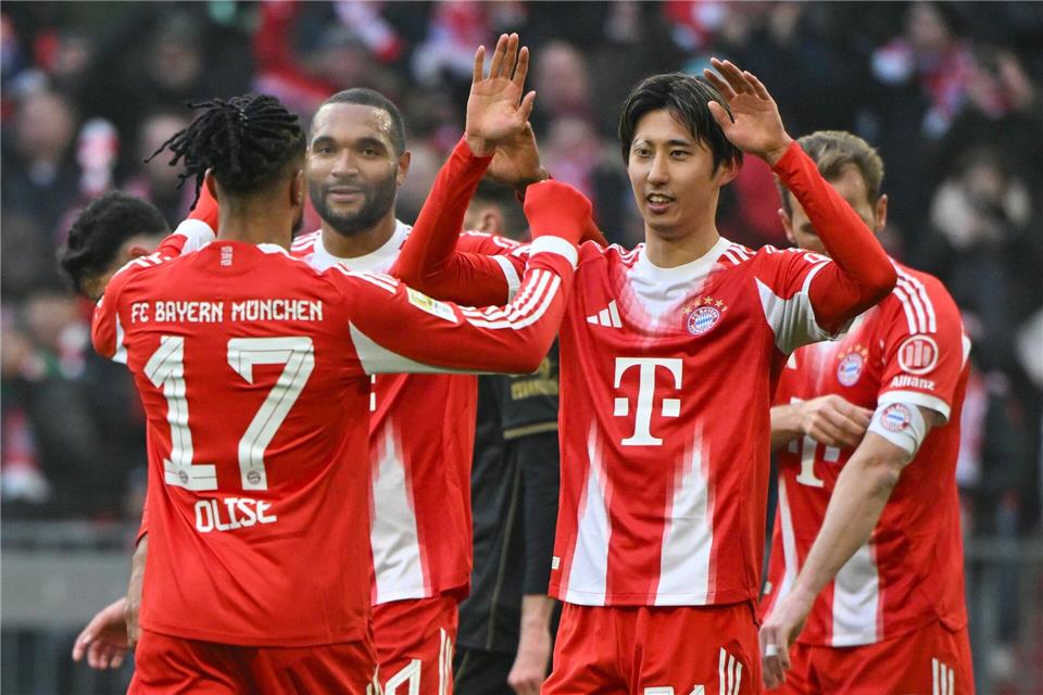 Hiroki Ito jubelt über sein Tor zum 1:0.Peter Kneffel/dpa