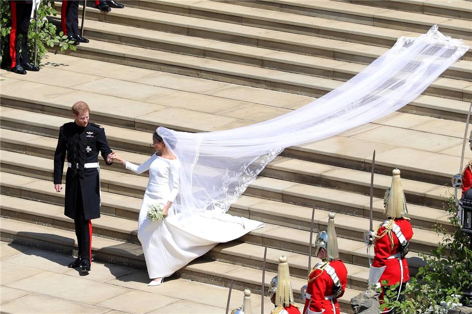 Hochzeit mit britischem Pomp: Schauspielerin Meghan Markle und Prinz Harry. (Archivbild)Andrew Matthews/PA Wire/dpa