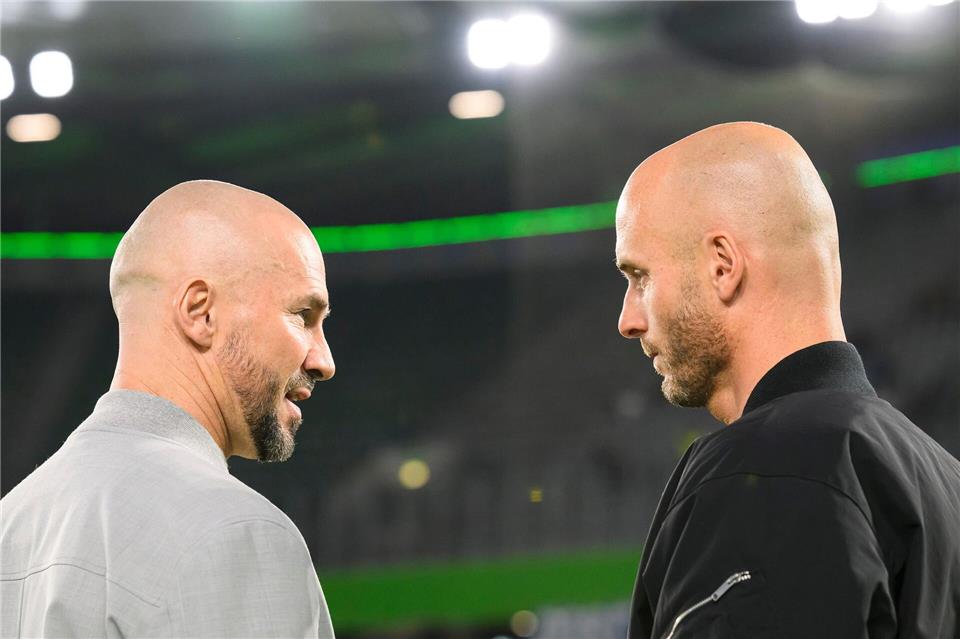 Hoffenheims Trainer Christian Ilzer (l) und sein Wolfsburger Kollege Paul Simonis.Swen Pförtner/dpa