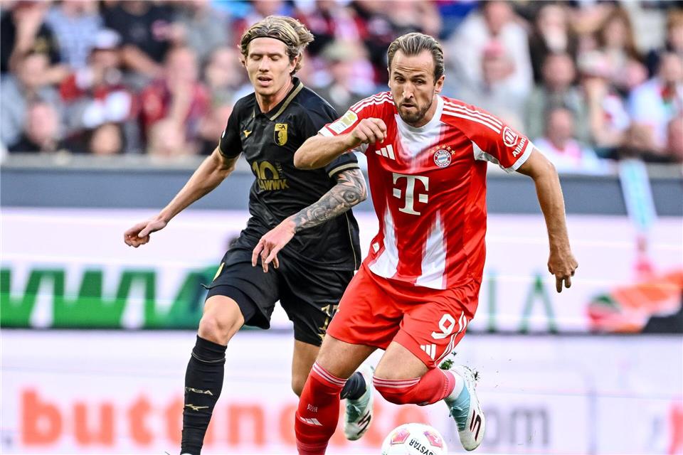 Kane (r) will die Bayern zum nächsten Sieg führen. (Archivbild)Harry Langer/dpa