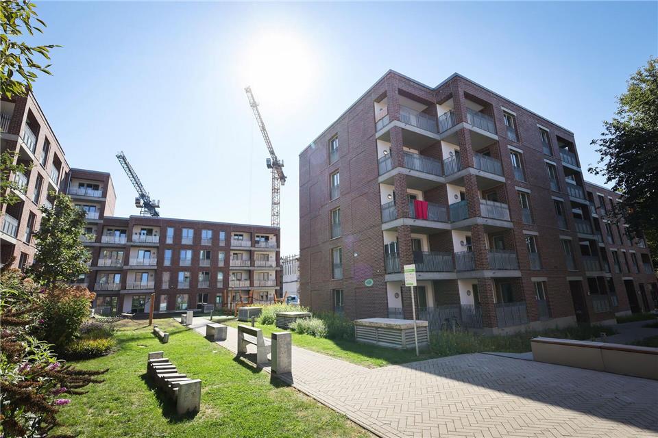 Kann Baukosten für den Einzelnen senken: in Gemeinschaft bauen.picture alliance/dpa