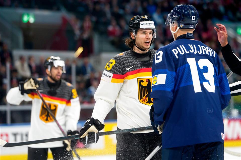 Kapitän Moritz Seider im Wortgefecht mit NHL-Kollege Jesse Puljujarvi.Claudio Thoma/KEYSTONE/dpa