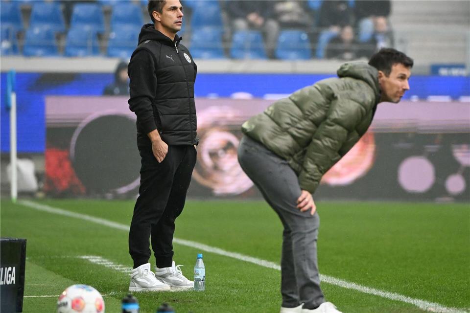 Marcel Rapp (l) muss mit Kiel die nächste Niederlage hinnehmen, Christian Eichner (r) darf aufatmen.Uli Deck/dpa