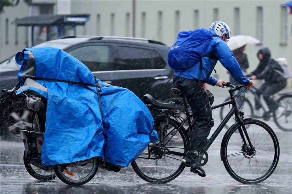 Regenschutz war in München am Abend angesagt. Malin Wunderlich/dpa