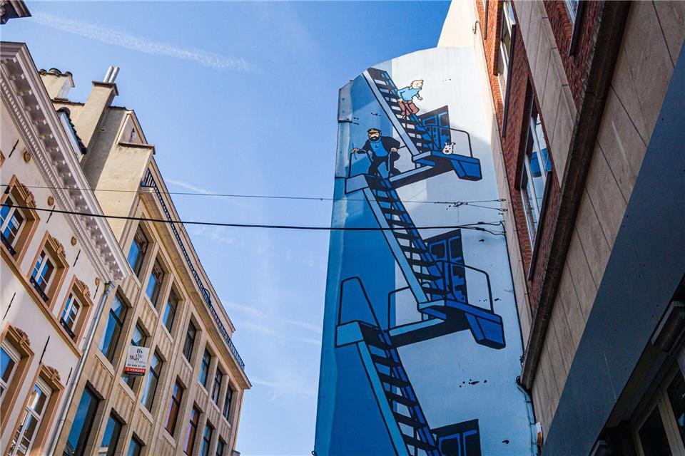 Brüssel in drei Tagen: Pralinen, Bier und Politik  „Tim und Struppi“ zählen zu den berühmtesten belgischen Comicfiguren - und sind in Brüssel auch in einem riesigen Wandbild verewigt. Es liegt gleich neben dem Schokoladenmuseum an der Rue de l’Etuve im Zentrum der Stadt.Jean-Paul Remy/visit.brussels/dpa-tmn